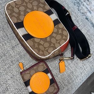 Authentic Coach “ Dempsey” crossbody in Signature Jacquard W/ stripe and patch.